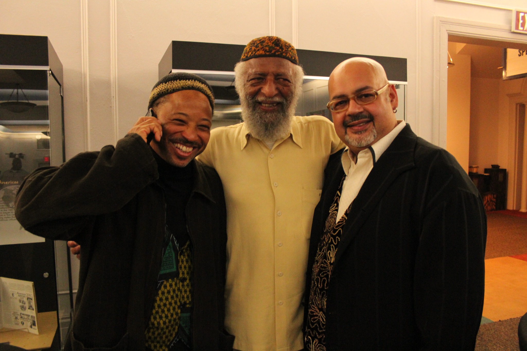 Bill Foster standing with two friends and collaborators at the 22nd anniversary celebration