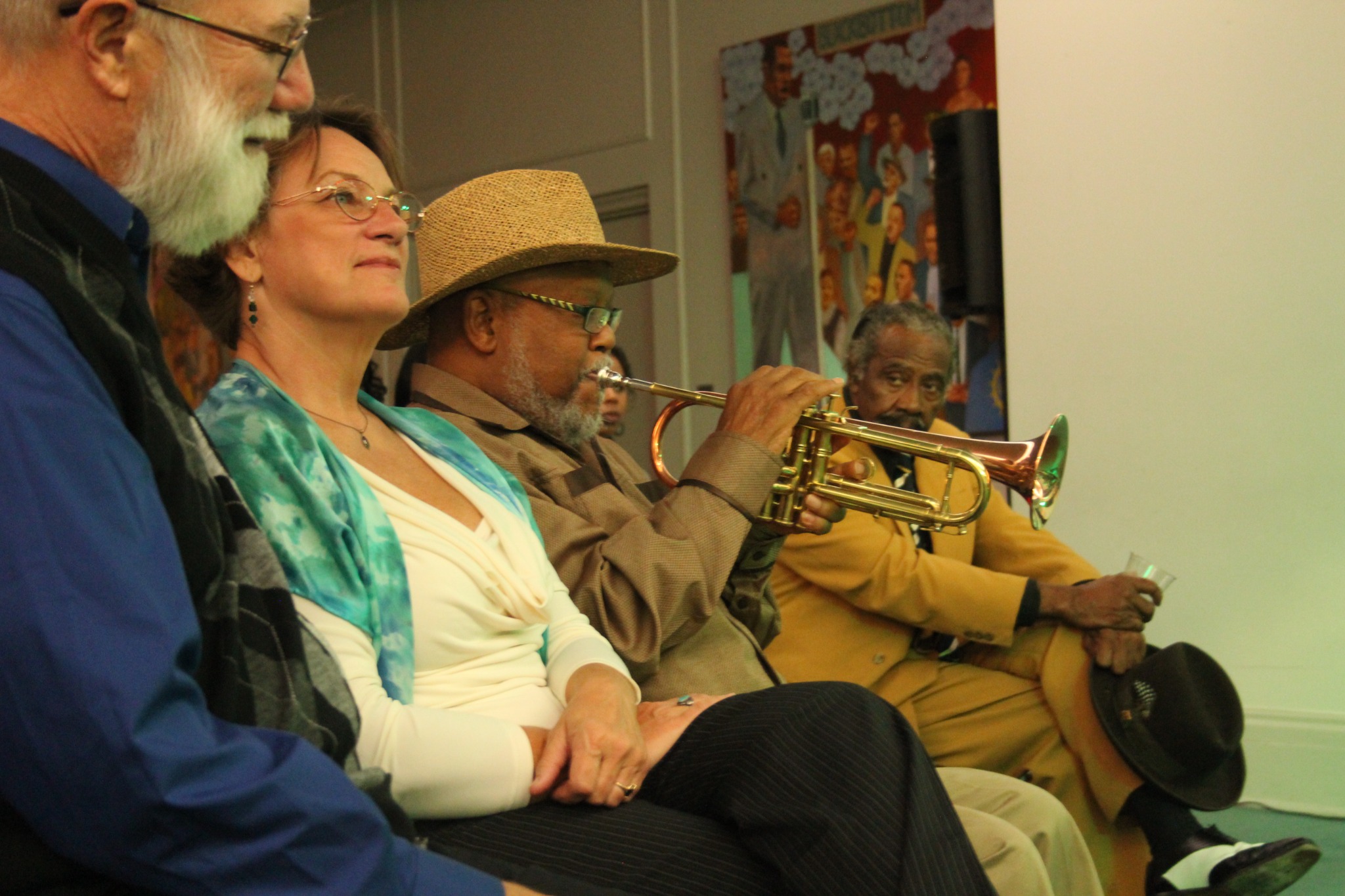 Guests and musicians gathered as a trumpeter plays during the Jazz Network Foundation anniversary celebration